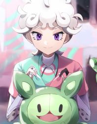 Rule 34 | 1boy, ahoge, bede (pokemon), blonde hair, blurry, bow, closed mouth, creatures (company), curly hair, eyelashes, game freak, gen 5 pokemon, green shirt, gvzzgl, hands up, highres, male focus, nintendo, pink shirt, pokemon, pokemon (creature), pokemon swsh, purple eyes, reuniclus, shirt, short hair, short sleeves, smile, undershirt