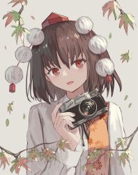 Rule 34 | 1girl, black hair, camera, hat, holding, holding camera, leaf, leaf print, long sleeves, looking at viewer, maple leaf print, ookashippo, open mouth, pom pom (clothes), red eyes, red hat, shameimaru aya, shirt, solo, tokin hat, touhou, upper body, white shirt