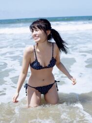 Rule 34 | 1girl, aida rikako, beach, bikini, highres, looking to the side, outdoors, photo (medium), ponytail, smile, standing, swimsuit, voice actor
