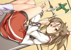 Rule 34 | 10s, 1girl, blush, brown eyes, brown hair, fetal position, hachimaki, hair ribbon, headband, high ponytail, japanese clothes, kantai collection, light brown hair, long hair, looking at viewer, lying, muneate, on side, personification, ponytail, ribbon, shake (ferit3), skirt, smile, solo, zuihou (kancolle)