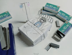 Rule 34 | 1boy, absurdres, avogado6, bed, black eyes, blue shirt, commentary request, from above, grey hair, highres, hospital bed, intravenous drip, jitome, long sleeves, lying, male focus, on back, on bed, original, papercraft (medium), pillow, shirt, solo, stapler, unconventional media