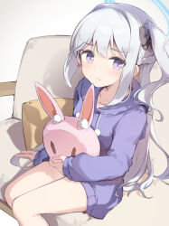 Rule 34 | 1girl, blue archive, blue halo, blue hoodie, blush, braid, breasts, closed mouth, collarbone, commentary request, feet out of frame, grey hair, halo, highres, hood, hood down, hoodie, long hair, long sleeves, miya kazutomo, miyako (blue archive), miyako (young) (blue archive), one side up, purple eyes, sitting, small breasts, solo, stuffed animal, stuffed rabbit, stuffed toy