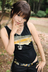 Rule 34 | 1girl, asian, bling, blurry, breasts, brown eyes, brown hair, contrapposto, depth of field, hand on own hip, jewelry, kipi-san, looking at viewer, mole, outdoors, pendant, photo (medium), ring, short hair, small breasts, solo, tagme, tank top, tree