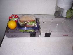 Rule 34 | famicom, food, fruit, game console, lowres, lunchbox, nes, nintendo, orange (fruit), photo (medium), sandwich