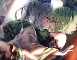 Rule 34 | 2girls, bare shoulders, blurry, blurry background, blush, commentary, frills, from side, green hair, hat, hug, long hair, long sleeves, looking at another, mononobe no futo, multiple girls, open mouth, piyokichi, ponytail, profile, short hair, soga no tojiko, sweat, tate eboshi, touhou, wide sleeves, yuri