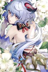Rule 34 | back, backless outfit, bare back, bare shoulders, black gloves, blue hair, blush, bow, bowtie, breasts, chinese knot, detached sleeves, flower, from behind, ganyu (genshin impact), genshin impact, gloves, gold trim, highres, horns, long hair, looking at viewer, looking back, lying, multicolored eyes, munmun zatta 39, on stomach, sideboob, solo, vision (genshin impact), white flower, white sleeves