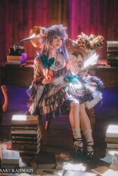 Rule 34 | 1girl, aqua bow, artist name, black footwear, blunt bangs, blurry, blurry background, book, book stack, bouquet, bow, chair, collarbone, commentary, cosplay photo, depth of field, dress, flower, frilled dress, frills, full body, hair bow, highres, holding, holding book, indoors, long sleeves, on chair, open book, open mouth, patchouli knowledge, photo (medium), purple hair, red bow, sakurajima211, socks, solo, symbol-only commentary, teeth, touhou, upper teeth only, white socks, wooden chair, wooden desk