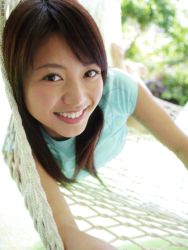 Rule 34 | 1girl, asian, blurry, breasts, brown hair, depth of field, hammock, hasebe yu, looking at viewer, photo (medium), shirt, small breasts, smile, solo, t-shirt, tagme