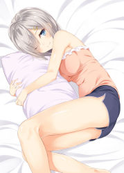Rule 34 | 10s, 1girl, bare arms, bare shoulders, bed, bed sheet, blue eyes, blue shorts, breasts, eyes visible through hair, hair ornament, hair over one eye, hairclip, hamakaze (kancolle), highres, kantai collection, light smile, looking at viewer, lying, medium breasts, hugging object, on side, one eye closed, pillow, pillow hug, pink shirt, shirt, short hair, shorts, silver hair, smile, solo, takehana note, tank top, thighs