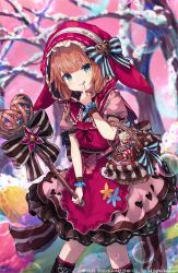 Rule 34 | 1girl, :q, animal hood, basket, bow, brown hair, candy, candy cane, commentary request, dress, finger to mouth, food, green eyes, grimms echoes, hat ornament, heart, heart hat ornament, heart print, highres, hood, icing, little red riding hood (grimms echoes), makihitsuji, pink dress, scrunchie, solo, tongue, tongue out, tree, valentine, wand, wrist scrunchie