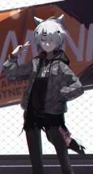 Rule 34 | 1girl, a.a (aa772), animal ears, arknights, black hoodie, black nails, black pants, camouflage, camouflage jacket, chain-link fence, chromatic aberration, commentary request, feet out of frame, fence, grey jacket, hair ornament, hair over one eye, hairclip, hand in pocket, hand up, highres, hood, hood down, hoodie, jacket, lappland (arknights), long sleeves, looking at viewer, nail polish, open clothes, open jacket, pants, parted lips, puffy long sleeves, puffy sleeves, purple eyes, sign, sleeves past wrists, smile, solo, standing, tail, v, white hair