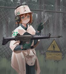 Rule 34 | 1girl, absurdres, ar-18, assault rifle, barbed wire, belt, black belt, bob cut, breasts, cape, chain-link fence, cigarette, clothes writing, commentary, english commentary, english text, fence, field cap, flipped hair, fog, forest, frown, gloves, grass, green eyes, green gloves, green jacket, green pants, gun, hair between eyes, hand up, headphones, headphones over headwear, headset, highres, holding, holding cigarette, holding gun, holding weapon, jacket, klottinen, light frown, looking at viewer, microphone, military uniform, nature, original, pants, poncho, red hair, rifle, shaded face, short hair, sign, small breasts, smoke, smoking, solo, tall grass, tree, uniform, warning sign, weapon, white cape