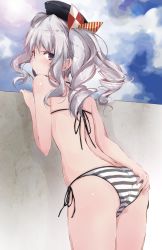Rule 34 | 1girl, ass, ass grab, beret, bikini, black hat, blue eyes, blue sky, cloud, commentary request, cowboy shot, day, from behind, grabbing own ass, halterneck, hat, kantai collection, kashima (kancolle), looking at viewer, looking back, outdoors, side-tie bikini bottom, sidelocks, silver hair, sky, solo, string bikini, striped bikini, striped clothes, swimsuit, tsurime, twintails, wall, wavy hair, yumesato makura