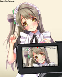 Rule 34 | 10s, 1girl, blurry, blush, brown hair, depth of field, head tilt, highres, long hair, looking at viewer, love live!, love live! school idol project, maid, maid headdress, minami kotori, pointing, pointing up, rogo (dok), smile, solo, song name, viewfinder, yellow eyes, yu-ta