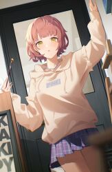 Rule 34 | 1girl, :o, absurdres, arm up, blue skirt, blurry, blush, brown hair, chain necklace, depth of field, dutch angle, highres, holding, holding brush, hood, hoodie, idolmaster, idolmaster shiny colors, ikuta haruki, indoors, jewelry, long sleeves, looking at viewer, necklace, odecono3, plaid, plaid skirt, pleated skirt, short hair, skirt, solo, yellow eyes, yellow hoodie