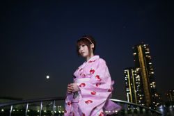 Rule 34 | 1girl, cityscape, hairband, japanese clothes, kimono, night, photo (medium), shio, solo, strawberry pattern, waterfront