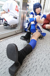 Rule 34 | 1girl, apron, asian, black footwear, blue eyes, blue gloves, blue hair, blue socks, blurry, boots, collar, color contacts, cosplay, cross, cuffs, depth of field, dutch angle, eyepatch, gloves, handcuffs, high heels, highres, hugging own legs, ikkitousen, indoors, kneehighs, looking at viewer, maid, maid apron, namada, on floor, panties, pantyshot, photo (medium), puffy short sleeves, puffy sleeves, reflection, ryomou shimei, ryomou shimei (cosplay), short sleeves, sitting, socks, solo focus, underwear, upskirt