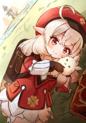 Rule 34 | 1girl, ahoge, backpack, bag, bloomers, blurry, book, brown gloves, cabbie hat, child, clover print, coat, commentary request, depth of field, dodoco (genshin impact), genshin impact, gloves, grass, hair between eyes, hat, hat ornament, highres, hugging doll, hugging object, klee (genshin impact), light brown hair, long hair, long sleeves, looking at viewer, low twintails, lying, ohbuya, on side, orange eyes, outdoors, pocket, pointy ears, randoseru, red coat, red hat, sidelocks, smile, solo, stuffed animal, stuffed toy, twintails, underwear