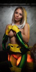 Rule 34 | 1girl, blonde hair, blue eyes, bodysuit, breasts, cameltoe, cleavage, cosplay, covering privates, covering breasts, cowboy shot, gloves, highres, looking at viewer, marvel, multicolored hair, photo (medium), rogue (x-men), rogue (x-men) (cosplay), solo, standing, tagme, white hair, x-men