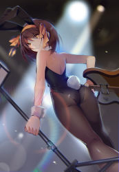 Rule 34 | 1girl, animal costume, animal ears, arms at sides, ass, back, bare back, black leotard, black pantyhose, blurry, blurry background, brown hair, dutch angle, electric guitar, eyes visible through hair, fake animal ears, from behind, guitar, hairband, highres, hmniao, holding, instrument, italia mondial, leotard, looking at viewer, looking back, microphone stand, pantyhose, playboy bunny, rabbit ears, rabbit tail, short hair, solo, stage, stage lights, suzumiya haruhi, suzumiya haruhi no yuuutsu, tail, twisted neck, wrist cuffs, yellow eyes