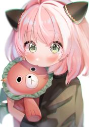 Rule 34 | 1girl, animal ears, anya (spy x family), black shirt, blurry, blush, depth of field, director chimera (spy x family), green eyes, highres, holding, looking at viewer, medium hair, pink hair, rojineco nene, shirt, simple background, soft focus, solo, spy x family, stuffed animal, stuffed toy, white background