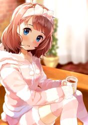 Rule 34 | 1girl, :d, blue eyes, blush, bow, brown hair, commentary, couch, cup, curtains, dot nose, feet out of frame, hair bow, hairband, highres, holding, holding cup, hood, hoodie, hot chocolate, idolmaster, idolmaster million live!, indoors, looking at viewer, nira (vira), open mouth, plant, potted plant, short hair, sitting, smile, suou momoko, thighhighs
