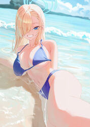 Rule 34 | 1girl, alternate costume, armpit crease, asuna (blue archive), asymmetrical bangs, bare shoulders, beach, bikini, blonde hair, blue archive, blue bikini, blue eyes, blue halo, breasts, cloud, commentary, day, eyes visible through hair, grin, hair over one eye, halo, halterneck, highres, large breasts, light blush, long bangs, long hair, looking at viewer, lying, mole, mole on breast, multi-strapped bikini bottom, navel, ocean, on side, outdoors, shore, smile, solo, starblue, stomach, swimsuit, underboob, water