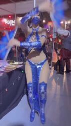 Rule 34 | 1girl, 6+others, animated, arms up, black hair, cosplay, face mask, hand fan, highres, kitana, looking at viewer, mask, mortal kombat (series), mouth mask, multiple others, navel, ninja, photo (medium), ponytail, real life, solo, sophie valentine, standing, tagme, video, wide hips
