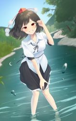 Rule 34 | 1girl, absurdres, black hair, black ribbon, black skirt, commentary, day, grin, hand up, hat, highres, kanpa (campagne 9), leaning forward, looking at viewer, medium hair, mountainous horizon, neck ribbon, outdoors, pointy ears, pom pom (clothes), red eyes, red hat, ribbon, river, shameimaru aya, shirt, short sleeves, skirt, smile, solo, tokin hat, touhou, tree, wading, water drop, white shirt