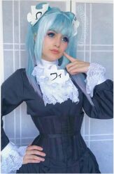 Rule 34 | absurdres, artist name, blue eyes, blue hair, contact lens, cosplay, finger to cheek, french maid (outfit), hand on own hip, highres, lace trim, photo (medium), puzzle piece, puzzle piece hair ornament, scifikantasy, wikipe-tan, wikipedia