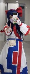 Rule 34 | 1girl, ainu clothes, asian, bathroom, blue eyes, blue hair, breasts, cellphone, cosplay, fingerless gloves, gloves, hair ribbon, highres, japanese (nationality), long hair, looking at viewer, nakoruru, phone, ribbon, samurai spirits, small breasts, smartphone, snk, the king of fighters, v