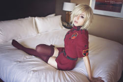 Rule 34 | 1girl, alternate costume, bed, blonde hair, blurry, blurry background, breasts, closed mouth, cosplay, female focus, hellsing, large breasts, looking at viewer, photo (medium), police, police uniform, red eyes, red legwear, seras victoria, short hair, sitting, solo, stephanie fischer, tagme, teeth, uniform, vampire