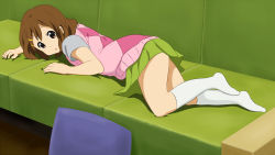 Rule 34 | 1girl, blush, brown eyes, brown hair, couch, full body, green skirt, hair ornament, hairclip, highres, hirasawa yui, hirondo, k-on!, looking at viewer, looking back, lying, miniskirt, on couch, on stomach, open mouth, pillow, short hair, skirt, socks, solo, white socks