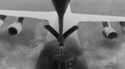 Rule 34 | 1other, aircraft, airplane, ambiguous gender, c-5m super galaxy, city, cloud, from above, girls und panzer, greyscale, highres, monochrome, payama, refueling, vehicle focus, wide shot