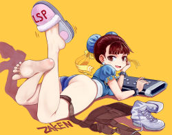 Rule 34 | 1girl, :d, absurdres, artist name, ass, bare legs, barefoot, blue dress, blunt bangs, blush, boots, bracelet, breasts, brown eyes, brown hair, brown pantyhose, bun cover, capcom, china dress, chinese clothes, chun-li, controller, double bun, dress, earrings, fang, feet up, game controller, hair bun, hair pulled back, hair ribbon, head rest, highres, jewelry, looking at viewer, looking back, lying, on stomach, open mouth, pantyhose, puffy short sleeves, puffy sleeves, ribbon, sash, shadow, shoes, short sleeves, simple background, single shoe, skin fang, slippers, smile, soles, solo, spiked bracelet, spikes, street fighter, toes, unitard, unworn boots, unworn clothes, unworn pantyhose, white footwear, yellow background, zaken