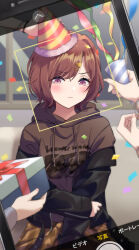 Rule 34 | 1girl, absurdres, black jacket, blush, brown hair, brown hoodie, cellphone photo, closed mouth, confetti, fingernails, gift, hair ornament, hairclip, hat, highres, higuchi madoka, holding, holding gift, holding party popper, hood, hood down, hoodie, idolmaster, idolmaster shiny colors, jacket, long sleeves, looking at viewer, mole, mole under eye, off shoulder, open clothes, open jacket, out of frame, party hat, party popper, purple hair, short hair, taking picture, v-shaped eyebrows, yeogpu (seung832222)