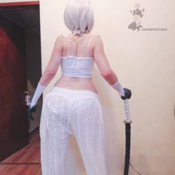 Rule 34 | 1boy, androgynous, arm support, ass, ass focus, cosplay, curvy, darkwaifutrap, from behind, highres, holding, holding sword, holding weapon, huge ass, katana, nier (series), nier:automata, on bed, pants, photo (medium), short hair, skin tight, solo, sword, trap, weapon, white hair, wide hips, 2b (nier:automata), 2b (nier:automata) (cosplay)