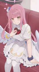 Rule 34 | 1girl, absurdres, blue archive, breasts, brown eyes, candy, capelet, chocolate, chocolate heart, commentary request, couch, dress, feathered wings, feet out of frame, food, grin, hair bun, halo, hand up, heart, highres, holding, holding food, indoors, large breasts, long hair, looking at viewer, low wings, mika (blue archive), on couch, pantyhose, pink hair, pink halo, ruha (ruha12haru), scrunchie, single side bun, sitting, smile, solo, valentine, white capelet, white dress, white pantyhose, wings, wrist scrunchie