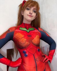 Rule 34 | 1girl, blue eyes, bodysuit, brazilian (nationality), breasts, brown hair, cosplay, evangelion: 3.0 you can (not) redo, hairpods, hands on own hips, highres, interface headset, lips, looking at viewer, medium breasts, memepantazis, neon genesis evangelion, photo (medium), photomontage, plugsuit, rebuild of evangelion, red bodysuit, shiny clothes, smile, solo, souryuu asuka langley, souryuu asuka langley (cosplay), standing, twintails, twitter username, two side up, wide hips