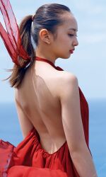 Rule 34 | 1girl, absurdres, backless outfit, blurry, blurry background, dress, highres, komiya arisa, looking to the side, open clothes, outdoors, photo (medium), ponytail, red dress, standing, voice actor