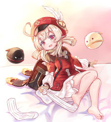 Rule 34 | 1girl, absurdres, ahoge, backpack, bag, barefoot, dress, feathers, feet, genshin impact, hair between eyes, hat, hat feather, highres, klee (genshin impact), long hair, long sleeves, looking at viewer, low twintails, on bed, pointy ears, red dress, red eyes, red hat, removing legwear, sitting, smile, soles, solo, toes, twintails, undressing, unworn socks, white feathers, wuhuo