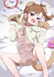 Rule 34 | 1girl, animal costume, animal ears, animal hands, asymmetrical bangs, bed sheet, blush, brown eyes, brown hair, choker, dog ears, dog paws, dog tail, dot nose, eyelashes, fake animal ears, fake tail, fang, foot out of frame, forehead, futami mami, highres, hood, hoodie, idolmaster, idolmaster (classic), idolmaster million live!, idolmaster million live! theater days, legs apart, long sleeves, looking at viewer, lying, official alternate costume, ohgi910, on back, on bed, open mouth, paw pose, pet food, shorts, side ponytail, sidelocks, solo, suspender shorts, suspenders, swept bangs, tail