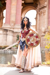 Rule 34 | 1girl, amazon warrior, armor, black hair, cape, cosplay, dc comics, greaves, highres, meagan marie, outdoors, photo (medium), pteruges, sandals, shield, standing, sword, vambraces, water, weapon, wonder woman, wonder woman (cosplay), wonder woman (series)