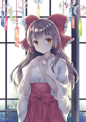 Rule 34 | 1girl, artist name, bow, breasts, brown eyes, brown hair, closed mouth, day, frilled hair tubes, frills, hair bow, hair ornament, hair tubes, hakurei reimu, hands up, indoors, japanese clothes, long hair, looking at viewer, mikako, sidelocks, smile, solo, touhou, wind chime
