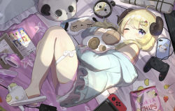 Rule 34 | 1girl, ahoge, alarm clock, blonde hair, candy, candy wrapper, chips (food), clock, closed mouth, commentary request, controller, dolphin shorts, food, fruit hair ornament, game controller, hair ornament, hairclip, headphones, highres, hololive, hood, hoodie, horns, lollipop, looking at viewer, lying, medium hair, nintendo switch, hugging object, on bed, on side, one eye closed, pajamas, pillow, potato chips, purple eyes, sheep horns, shorts, slippers, solo, stuffed animal, stuffed sheep, stuffed toy, tatedano kabae, thigh strap, thighs, tsunomaki watame, tsunomaki watame (loungewear), virtual youtuber, waking up