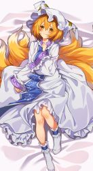 Rule 34 | 1girl, animal ears, animal hat, blonde hair, blush, breasts, closed mouth, commentary request, dress, eyes visible through hair, fox ears, fox tail, frills, frown, full body, hair between eyes, hand up, hat, head tilt, highres, kitsune, large breasts, long sleeves, looking at viewer, lying, manarou, mob cap, multiple tails, no shoes, on back, petticoat, raised eyebrows, short hair, solo, tabard, tail, tassel, touhou, white dress, white hat, wide sleeves, yakumo ran, yellow eyes