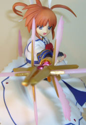 Rule 34 | 00s, 1girl, :d, aiming, aiming at viewer, blue eyes, bow, bowtie, energy wings, figure, fingerless gloves, gloves, hair ribbon, holding, holding weapon, lance, long sleeves, lyrical nanoha, magazine (weapon), magical girl, mahou shoujo lyrical nanoha, mahou shoujo lyrical nanoha a&#039;s, open mouth, orange hair, photo (medium), polearm, purple eyes, raising heart, red bow, red hair, ribbon, short hair, smile, solo, takamachi nanoha, twintails, weapon, white devil, wings