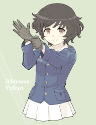 Rule 34 | 1girl, adjusting clothes, adjusting gloves, akiyama yukari, blush stickers, brown eyes, brown hair, character name, commentary request, english text, girls und panzer, glove pull, gloves, green background, hand up, haniwa (leaf garden), highres, jacket, long sleeves, looking at viewer, messy hair, military, military uniform, ooarai military uniform, pleated skirt, short hair, skirt, smile, solo, uniform, upper body
