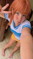 Rule 34 | 1girl, barefoot, black eyes, brazilian (nationality), breasts, cosplay, feet, female pubic hair, highres, indoors, looking at viewer, nami (one piece), nami (one piece) (cosplay), nerokosplayer, one piece, orange hair, photo (medium), pubic hair, real life, short hair, small breasts, solo, standing, toes, v