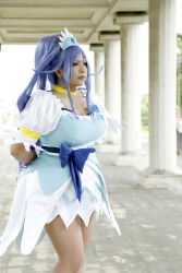 Rule 34 | 1girl, ankle boots, arms behind back, asian, blue eyes, blue hair, boots, bow, bracelet, breasts, choker, chouzuki maryou, cosplay, cure diamond (cosplay), dokidoki! precure, dress, headpiece, highres, jewelry, large breasts, long hair, magical girl, matching hair/eyes, photo (medium), plump, ponytail, precure, puffy short sleeves, puffy sleeves, ribbon, short sleeves, solo, tiara